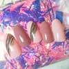 Valse nagels 24 stks druk op roze kleur ovale kop midden lengte slijtage afgewerkte product draagbare volledige deksel nep nagels voor meisjes