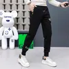 Pantaloni casual da uomo che stampano la stampa Design bello Leggings di marca di moda Pantaloni sportivi da uomo sottili Pantaloni lunghi neri Abbigliamento da uomo