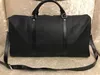 Projektanci moda Duffel Luxe Men femme de voyage en cuir Main de Grande Capacit Portez Sur Bagages Sac Week-End Nuit Avec Serrure