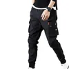 Jesienne mężczyźni Hip Hop harem joggery męskie spodnie męskie solidne wielopokomienne spodnie ładunkowe chude dopasowane spodnie dresowe 220811