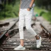 Herenbroek groothandel 2022 mode casual hiphop tieners scheurde jeans slanke elastische voeten zomer jeugdstudenten harembroeken