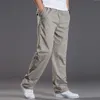 Calça de algodão de carga casual masculina Men bolso de calças retas de calças elásticas da marca de calças de trabalho de trabalho de corrida masculino super grande tamanho 6xl 220811