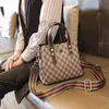 محافظ حقيبة دلو المرأة 2022 الصيف الجديدة حقيبة يد مطبوعة كبيرة النطاق العريض واحدة الكتف مسافة قطري حقائب اليد