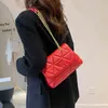 % 60 indirim online fabrika boşluk zinciri versiyonu düz renk yumuşak deri eşkenar eşek kafesi işlemeli iplik çantası moda tek omuz çantası