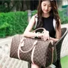 M41414 topkwaliteit mannen duffle keepall tas dames hand bagage reistassen heren pu lederen handtassen grote crossbody tassen bakken 55 cm