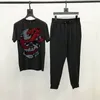 メンズトラックスーツM-5XLラインストーンヘビとスカルテーマTシャツスリムフィットラグジュアリーセットメンズトラックスーツブランド短袖