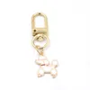 Groothandel honden poot print hanger Keychain mode sleutel ringen zipper pull charm planner charms accessoires hangbag hangende hangers sleutelen voor vrouwelijke meisjes