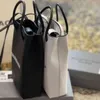 Bolsas de desenhista 2024 Novo Paris Telefone Celular Puro Carta de Couro Portátil Msenger Moda e Versátil Mini Unissextote Bolsas Senhoras Bolsas Noite Embreagens