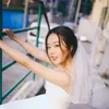 1つのレイヤー櫛ファッションソフトチュールホワイトアイボリー肩の長さの女性ヘアアクセサリーと結婚式CL0944を備えた1つの短いブライダルベール