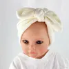 Stickad nyfödd baby flickor sjukhus hatt med båge baby pojkar turban hatt spädbarn kanin bowknot mössor wrap moft bebes stickade skalle