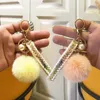 Femmes porte-clés en peluche moelleux fourrure Pom Pom porte-clés avec gland doux fausse fourrure boule voiture porte-clés porte-clés sac pendentif bijoux