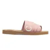 Тапочки 2022 Дизайнерские холст -тапочки Женщины древесные мулы плоские сандалии резиновые слайды белый черный розовый парус бордо