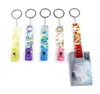 Kartengrabber -Schlüsselanhagen für Frauen Lange Nägel Acryl -Debit Bankkarten Grabber Schlüsselkette Keyrings ATMAT -KARTE CLIP POM BALL