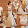 Elfenbensspetsapplikationer champagne sjöjungfru bröllopsklänningar öppnar tillbaka 3D blommor sexiga brudklänningar ny ankomst sjöjungfru klänning334n