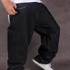 Tam siyah bol kot pantolon erkekler hip hop sokak kıyafeti kaykay kot pantolon gevşek uyum