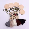 Custom Cotton Tassel Silicone Bead Key Ring Wholesale Carved Wood Disc Boho Straight Keychain