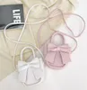 Nette Kleinkind Baby Messenger Handtasche Kinder Mädchen Prinzessin Schulter Tasche Handtaschen Solide Bowknot Prinzessin Münze Geldbörsen