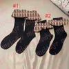 Chaussettes longues mignonnes bas noirs élastiques maison vêtements lettre impression chaussettes pom-pom girls bas