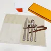 Set di posate in argento dorato cucchiaio forchetta coltello da cucina da campo intaglio set di stoviglie per tè in acciaio inossidabile utensili da cucina 304