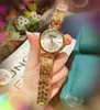 Luxus-Dame-Armband-Frauen-Bienen-Quarz-Armbanduhren Beliebte Edelstahl-Band-Frauen-Mode-Mädchen-Kristall-Stil-Uhr