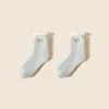 Chaussettes thermiques hiver femmes épaissir laine cachemire neige chaussettes sans couture doux couleur unie velours bottes sol chaussette de couchage