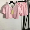 レディーストゥピースパンツデザイナー刺繍レター女性カジュアルTシャツレディ半袖フィットネスウェアl9fiのための弾力性ウエストプリントスカート