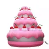 Anniversario che celebra la gigantesca torta di compleanno gonfiabile con modello di torta rosa ciliegia per la decorazione della festa