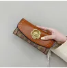 Luxury Design Bag Shop Wholesale and Retail Camellia Short Folding Plånbok Kvinnor 2023 Nytt multikort Big Money Fashion Versatile Small Function