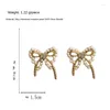 Dos Boucles D'oreilles Style Coréen Élégant Imitation Perles Arc Clip Sur Femme Simple Doux Petit Papillon Pas D'oreilles Trou