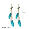 Boucles d'oreilles pendantes bohème plume femme bijoux Style ethnique fait main en bois perle feuille chaîne Boho Long gland