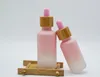 Botella cuentagotas de vidrio esmerilado Pipeta Goteo Color rosa con tapa de bambú Botella de aceite esencial de 1 oz 5ml 10ml 20ml 30ml 50ml 100ml Caja de embalaje