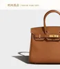 Designer väska kvinna handväska messenger väska litchi texturerat bovint läder axel crossbody classic womans tote väskor171m