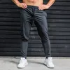 Calça masculina elasticidade homens correndo calças casuais calças de moletom com zíper bolsos treinando jogging academ