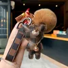 Designer keychain bear leather fur ball charm key chain car pendant metal fashion personality creative couple checkered variety of styles very pretty