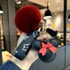 Keychain de designer Urso Cabeça de couro pendente de penteado Chave de cadeia Bow Pinging Pingente Metal Fashion Personalidade criativa
