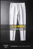 Herrenjeans Designer 2022 Sommerjeans Herren vielseitige schwarz-weiße zweifarbige Baumwolle elastisch kleine Füße schmal geschnitten 284Z