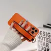 Designer Orange Silicone Phone Falls för iPhone 14 13 12 11 Pro Max Plus mobiltelefonskydd med handledsband