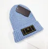 Cappello lavorato a maglia di qualità Commercio estero Autunno e inverno Ispessimento Cappelli di lana caldi Cappellino con maniche a cuffia