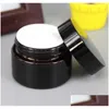 Bottiglie di imballaggio Barattolo di crema di vetro marrone ambrato Coperchio nero 515 30 50 100G Imballaggio cosmetico Campione Occhio 236 J2 Drop Delivery Office Schoo Dhcs8