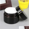 Bottiglie di imballaggio Barattolo di crema di vetro marrone ambrato Coperchio nero 515 30 50 100G Imballaggio cosmetico Campione Occhio 236 J2 Drop Delivery Office Schoo Dhcs8