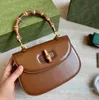 Kvinnors designers handväskor med bambu totes väskor lyxiga vintage liten topphandtag väska dam toppkvalitet tote 2022 52 mode crossbody shouler purses 1947