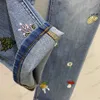 Jeans Donna Tessuto di cotone denim lavato Pantaloni di jeans con ricamo di fiori di funghi Pantaloni a vita alta elasticizzati dimagranti Abbigliamento da donna di marca di lusso 1970