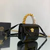 NOVA EXPLOSION SACOS femininos da bolsa Bola Mini bolsa Black Patente Couro criado Handeld, alça de ombro Botão magnético Designer de cadeia de fechamento