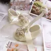 Первые ходьбы Dolldling Baby Shoes vivory Lace Vintage Luxury Pealrs Charm Girl Shoe Wedding Swedmed