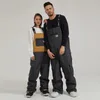 Skiingbroek één stuk winter ski mannen sneeuw jumpsuit vrouwen waterdicht snowboard pant winddicht losse warm pak vrouwelijk overalls