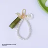 Fashion Car Keychains Pendant Casual Antique Bell Orchid Green Ribbon Pearl Designer Key Chain With Letter Heart Bow Pendant Chain