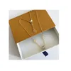 Avec des concepteurs de boîtes Pendentif Gold pour femmes Colliers d'anneau 18K Men en acier Unisexe Collier Diamond Pendants pour les amoureux Gift3528042