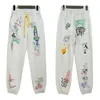 Abbigliamento da uomo Chaopai Rhude High Street Cartoon Graffiti Pantaloni larghi casual per uomo e donna