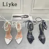 Sandaler Liyke 2022 Summer New Chain Ankle Strap Sandaler Kvinnor Sexig pekad tå snörning Transparent High Heels Party Wedding Dress Shoes T221209