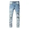 Jeans de marque European rock revial jean trous de broderie motif déchiré marque de mode vintage jean slim droit pantalon patché avec de nombreuses poches pour homme